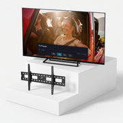 TELE System TS43FL4KSMV13 43" TV + Free Manhattan Fixed Wall Mount — TV and wall mount on light grey background
