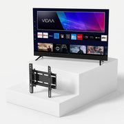 Τηλεόραση TELE System SONIC43FL4KSMV13 43" + Δωρεάν Βάση Τοίχου Unitronic Ανακλινόμενη — τηλεόραση και βάση τοίχου σε ανοιχτό γκρι φόντο